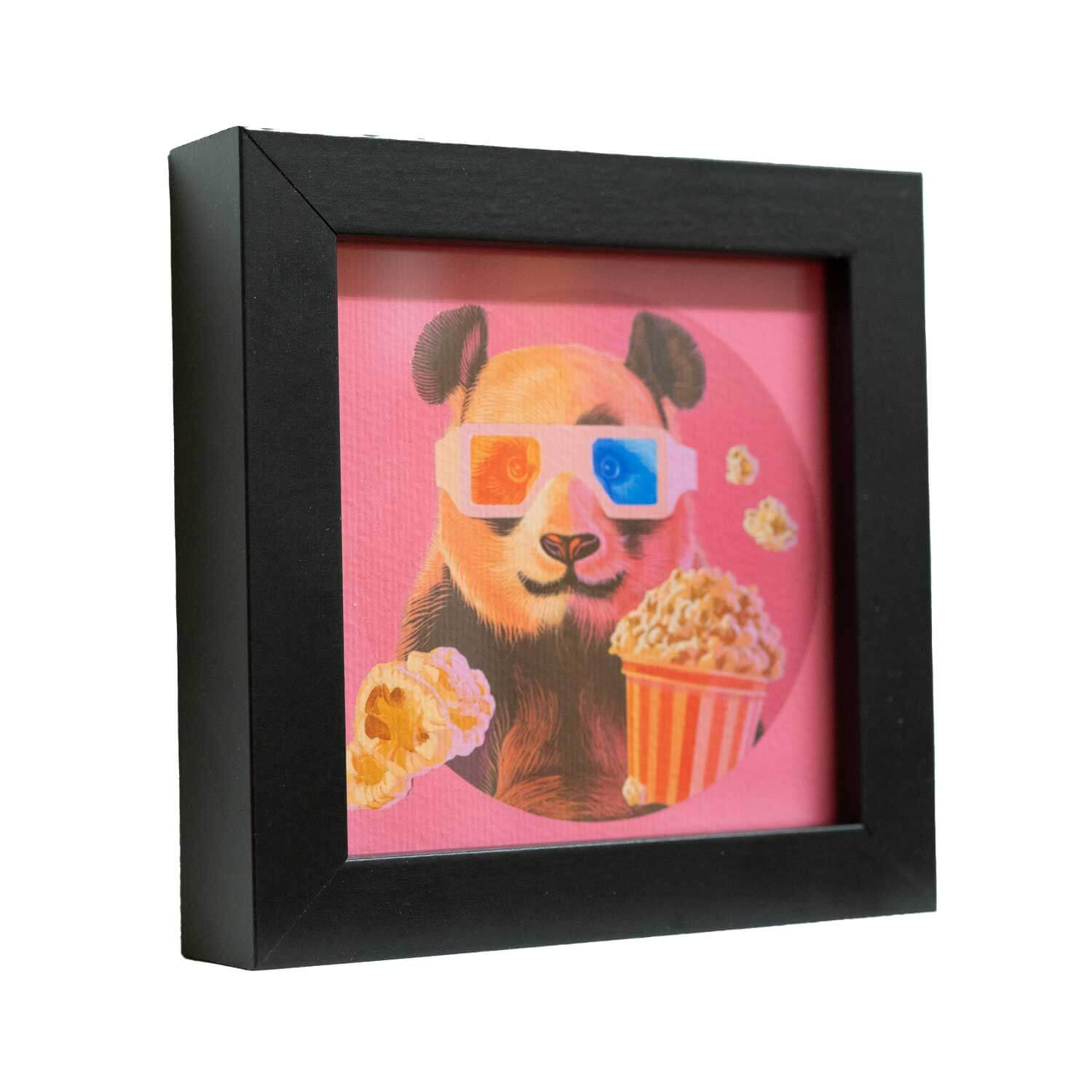 Cute panda in 3D glasses with popcorn, framed print for fun decor, perfect for sprucing up any space.