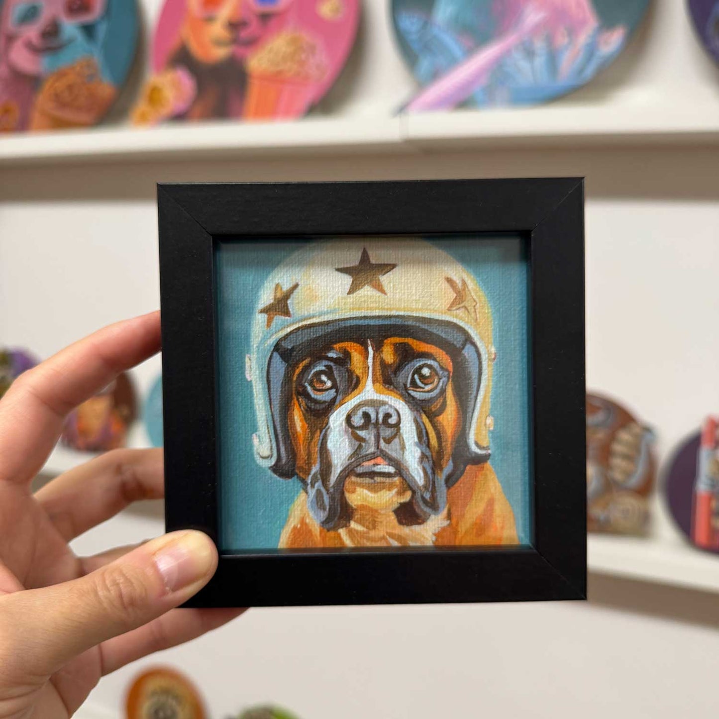 Cute framed art print of a Boxer dog wearing a helmet, perfect for brightening up any space!