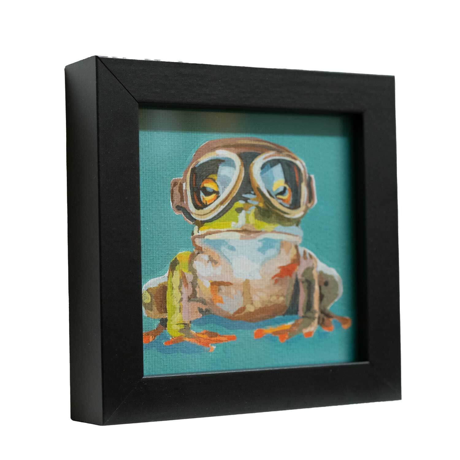 Cute framed art print of an adventurous frog wearing goggles, perfect for brightening up any space!