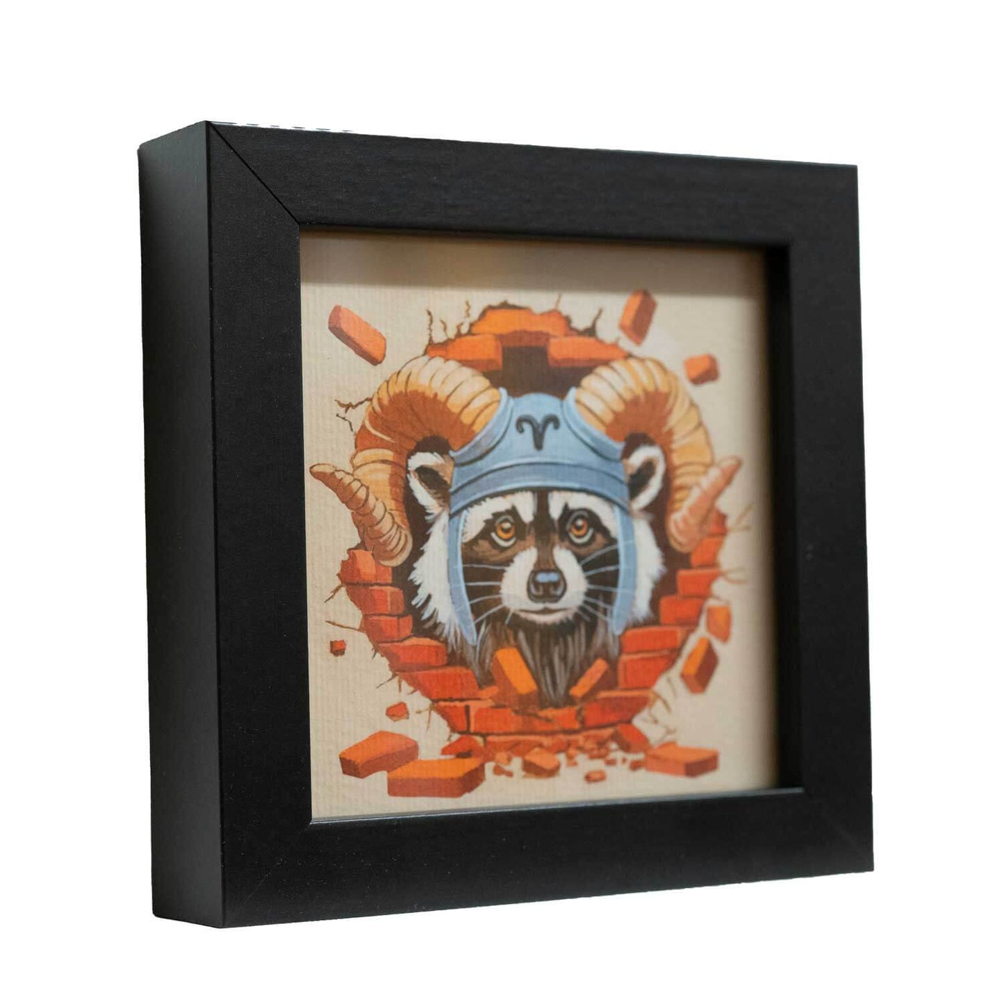 Cute raccoon art print in a black frame, featuring a ram's horn design, perfect for zodiac lovers.