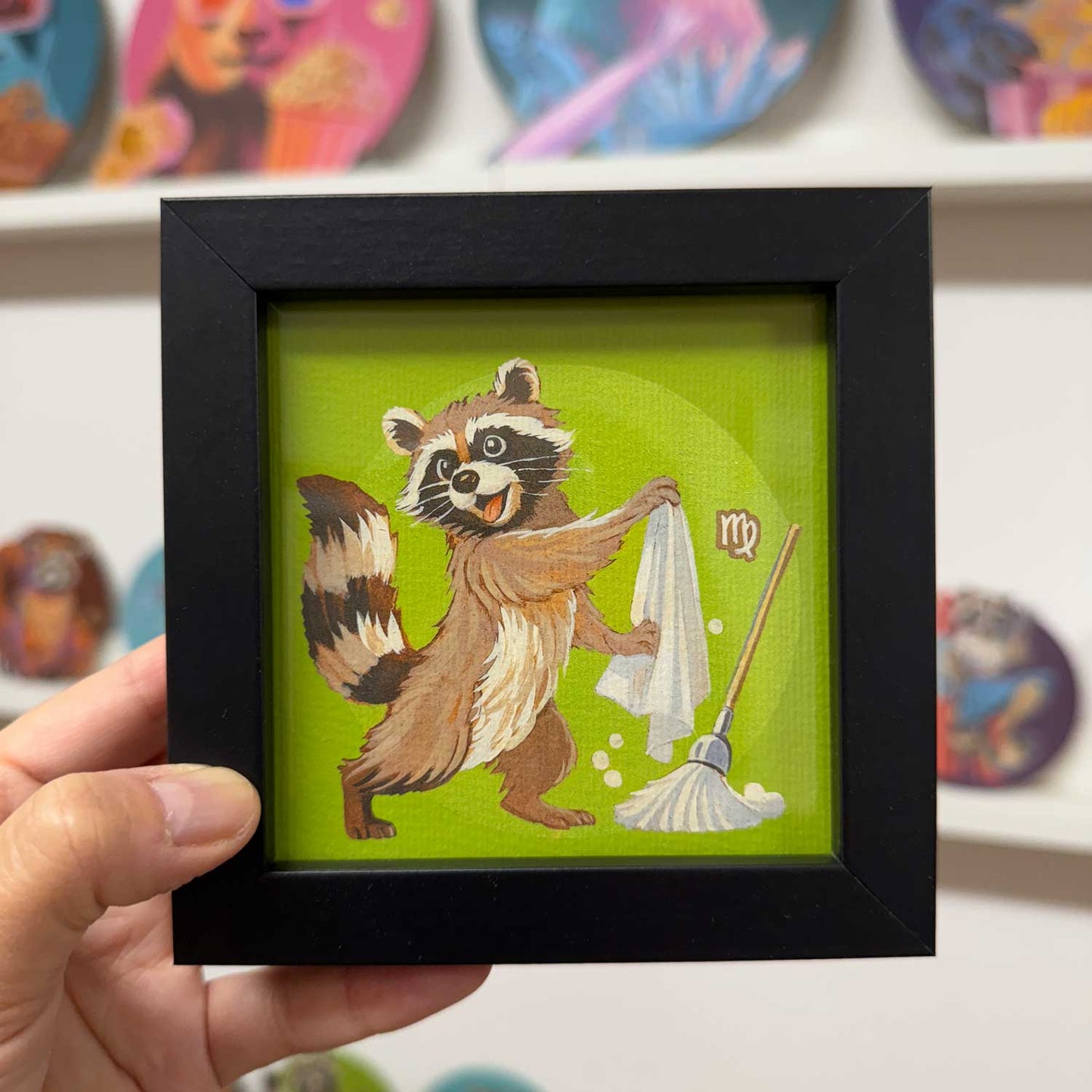 Cute raccoon illustration in a black frame, highlighting the Virgo zodiac sign, perfect for brightening any space.